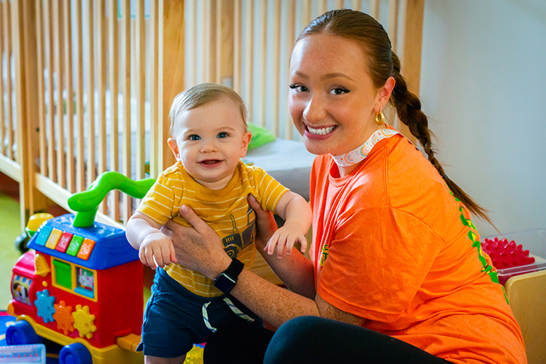Image of child and caregiver
