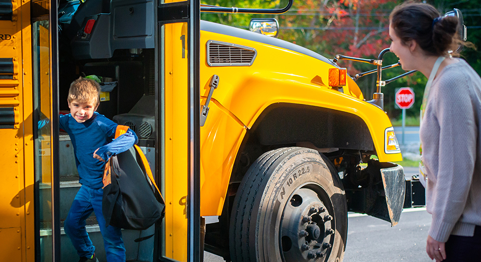 Image of child getting of a bus