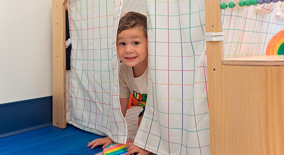 Image of child in indoor play fort