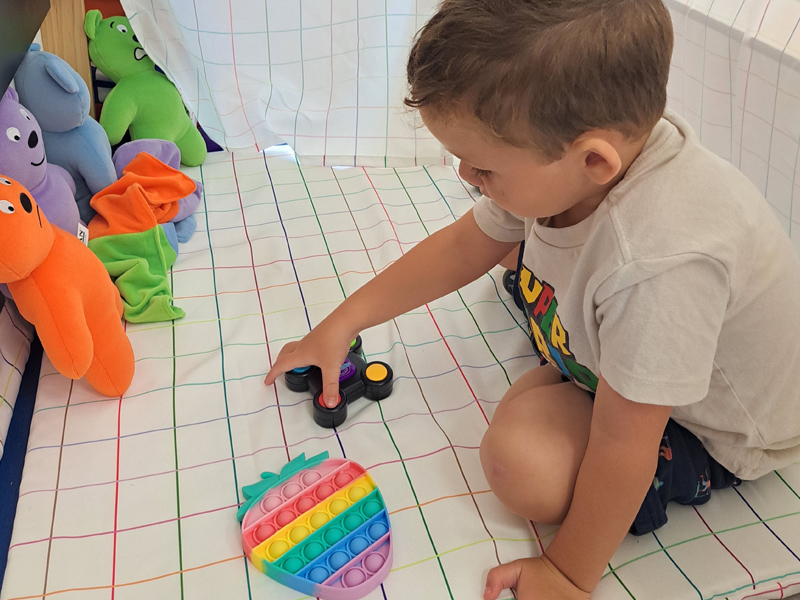 Image of child in a cozy play fort